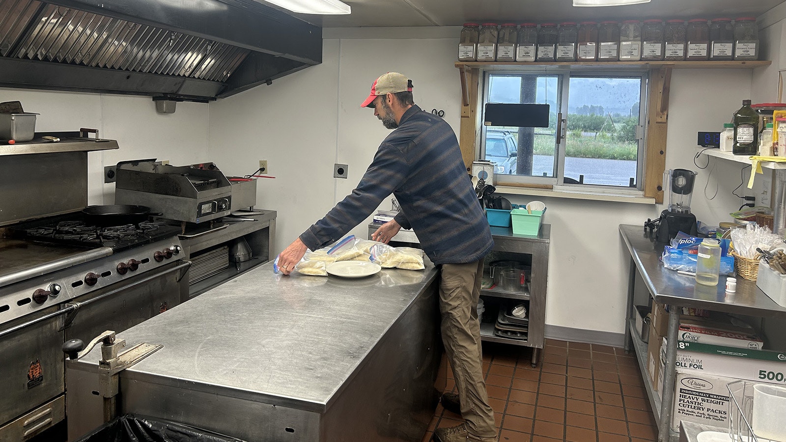Matt Accurso makes empanadas at the Branding Iron Café in Bondurant.