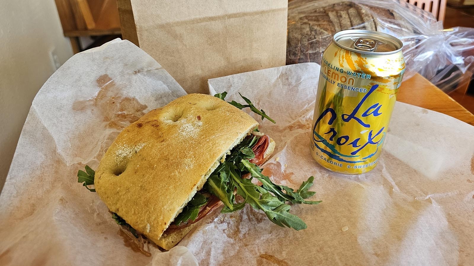 For lunch, an Italian sandwich on sourdough with leafy greens and sparkling lemon water. Very European!