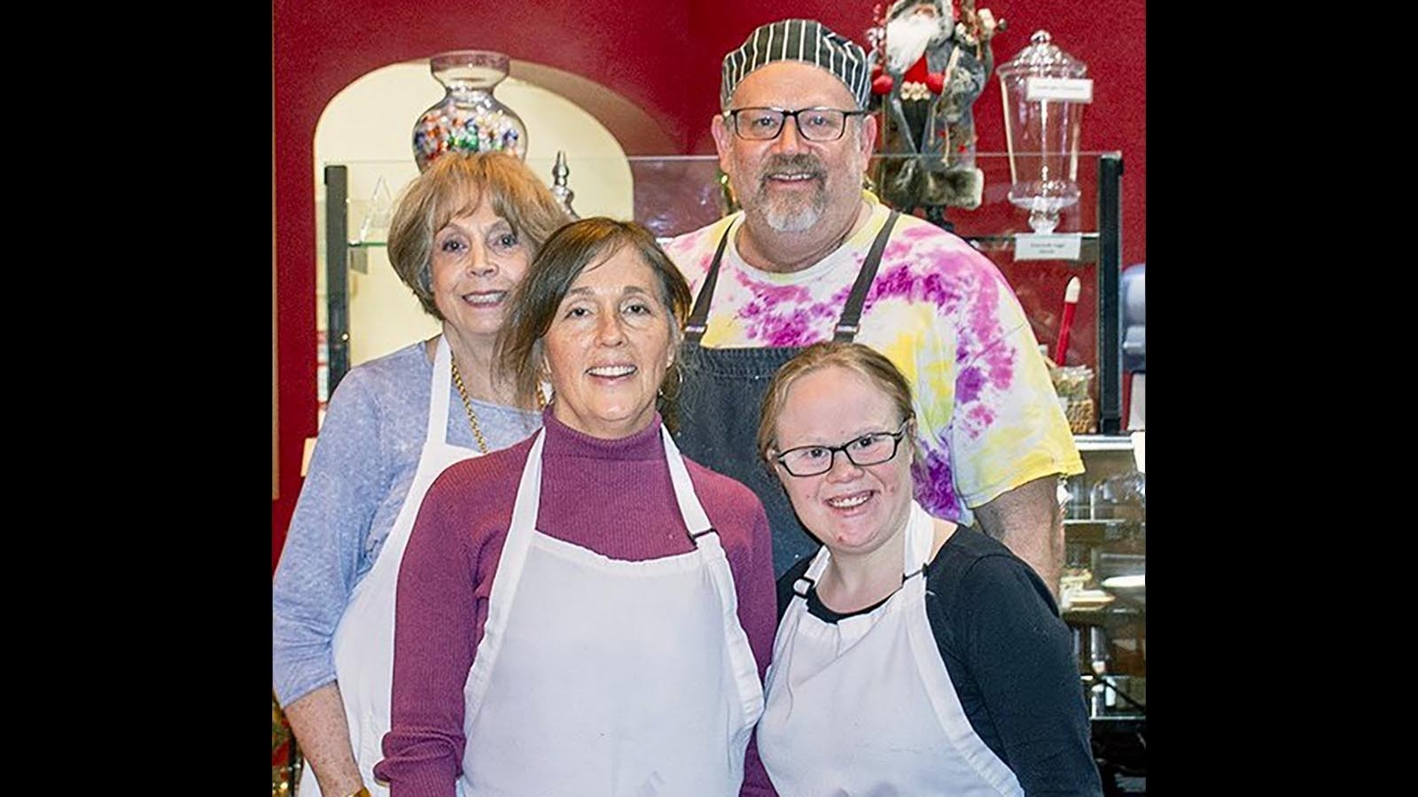 Bread Doctor Ezdan Fluckiger, back right, poses with his baking teacher Marda Soltiar, back left, his wife Lisa, front left, and his daughter Eleanor.