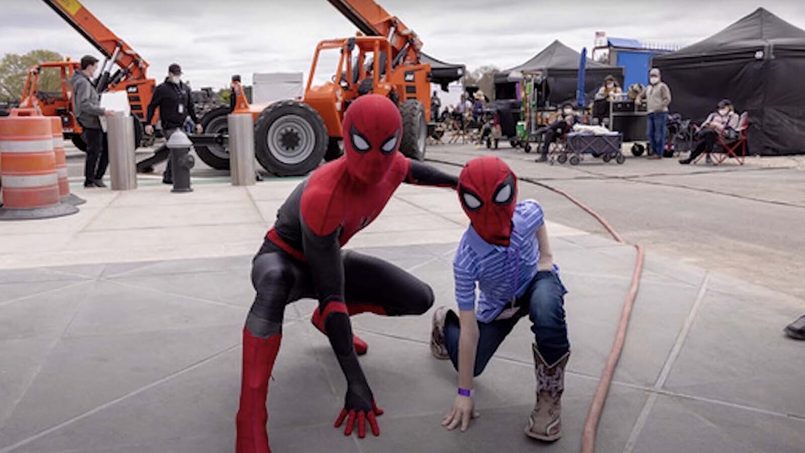 Bridger, right, and actor Tom Holland pose on the movie set of a Spider-Man movie.