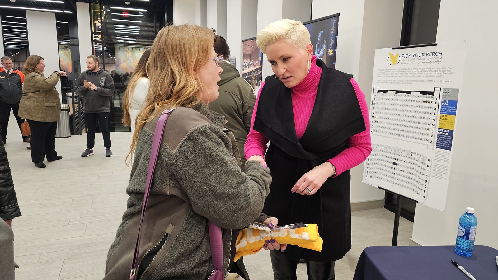 Nancy Rich, a student at Laramie County Community College studying business and accounting, shakes hand with Amanda Brinkman, who was in Wyoming on Thursday to talk about lessons learned from her hit reality television series.