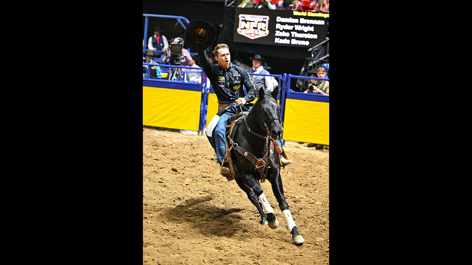 Saddle Bronc rider Brody Wells celebrates after riding Resistol's Pretty Woman of Pete Carr Pro Rodeo for 90 points to win Round 2 of the National Finals Rodeo at the Thomas & Mack Center in Las Vegas on Dec 6, 2024.