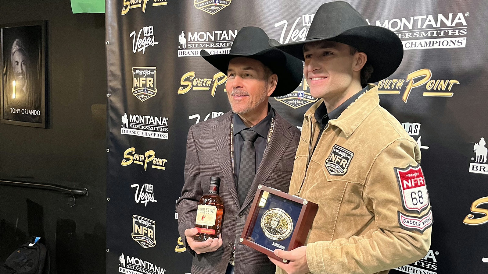 Brody Wells, right, after winning a round at the 2024 National Finals Rodeo.