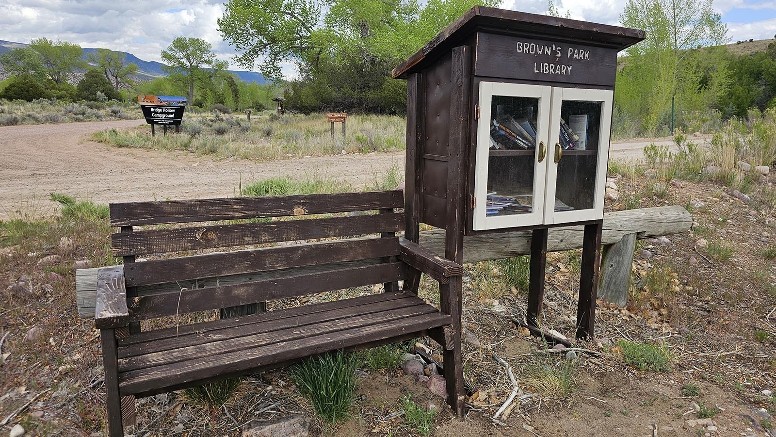 Brown's Park offers a quiet reading spot and a free library.