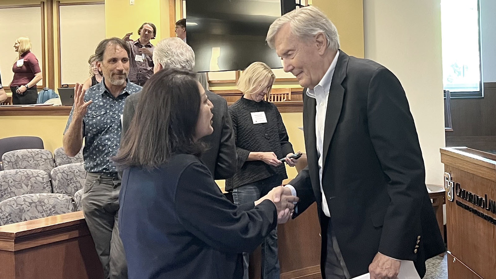 Former U.S. Interior Secretary and Arizona Governor Bruce Babbitt meets with Nora McDowell, a representative of the Fort Mojave Indian Tribe on Friday during the “Crisis on the Colorado River” conference in Boulder, Colorado.