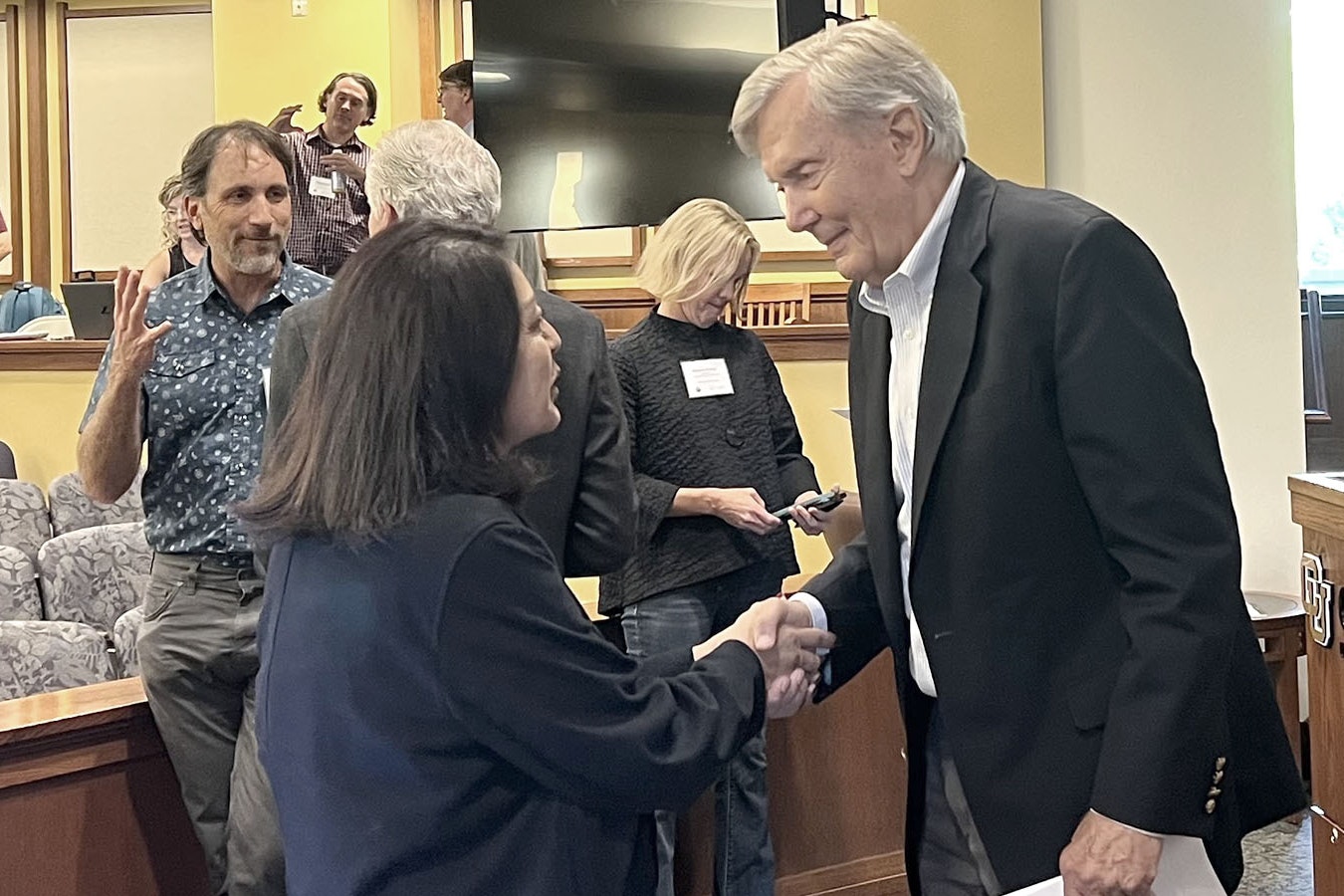 Former U.S. Interior Secretary and Arizona Governor Bruce Babbitt meets with Nora McDowell, a representative of the Fort Mojave Indian Tribe on Friday during the “Crisis on the Colorado River” conference in Boulder, Colorado.
