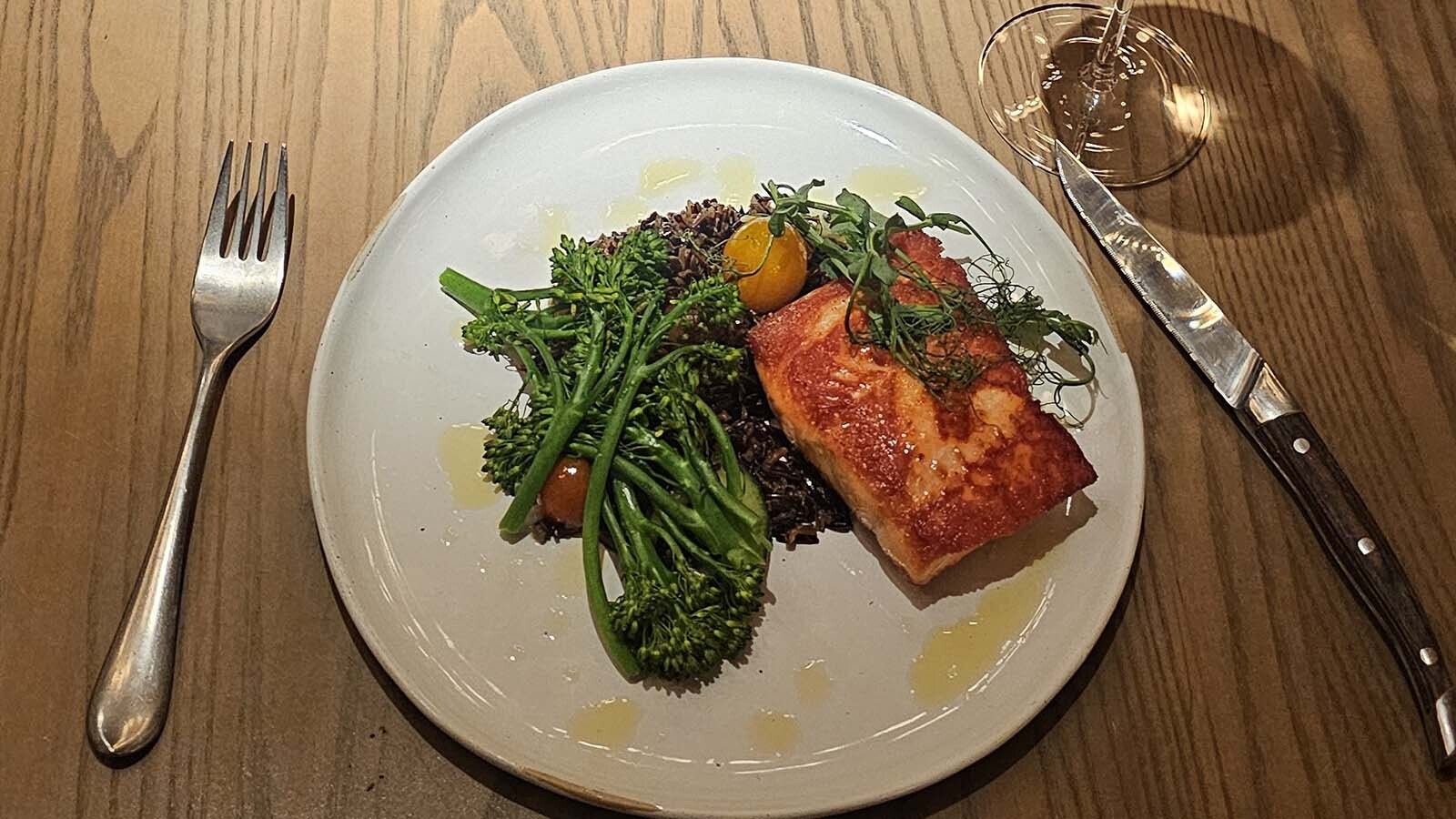 A dinner of salmon with broccolini and chewy wild rice with fry bread and a bottomless glass of white wine was ready in spite of my late arrival at Brush Creek Ranch.