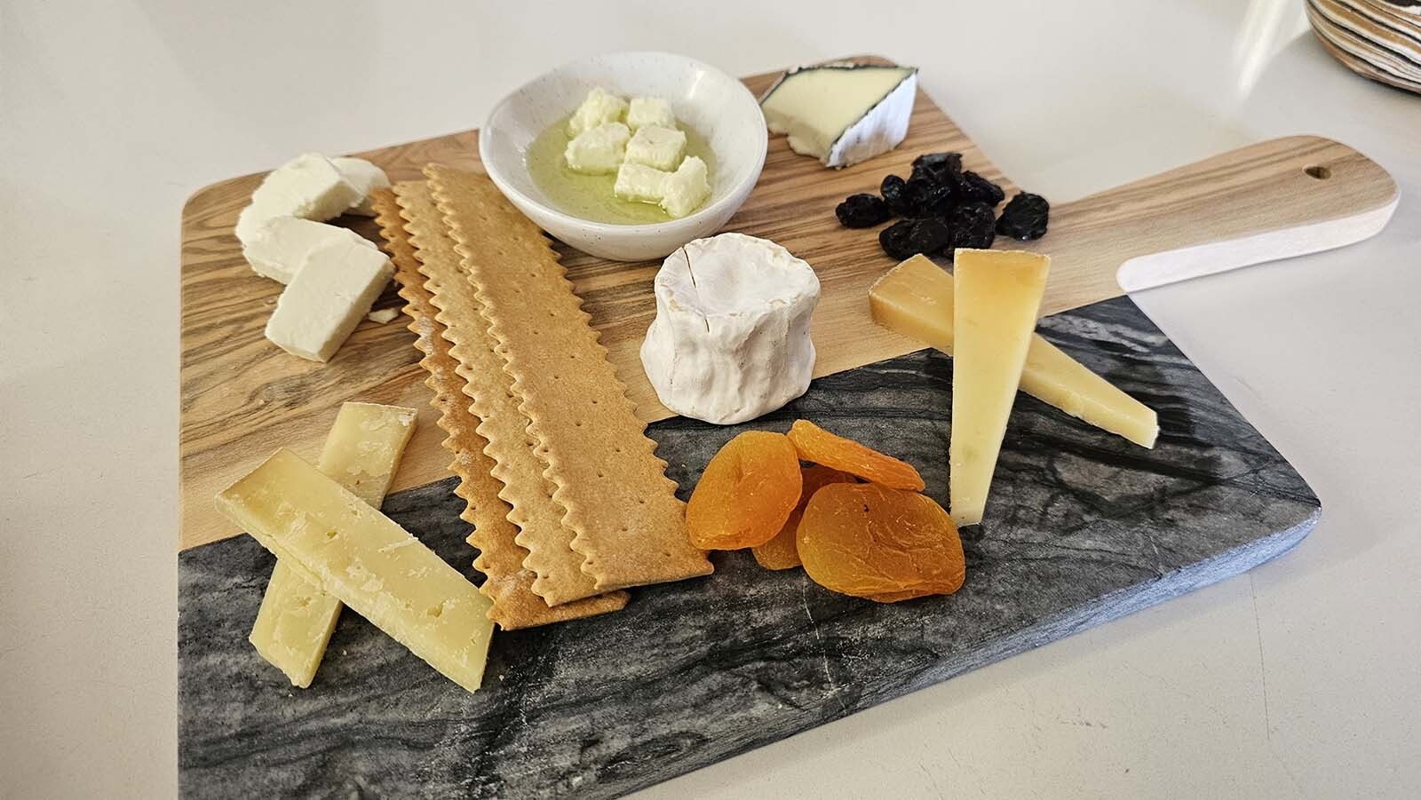 A cheese board of six goat cheeses makes for delicious revenge on the goats who tried to steal my charging cord.