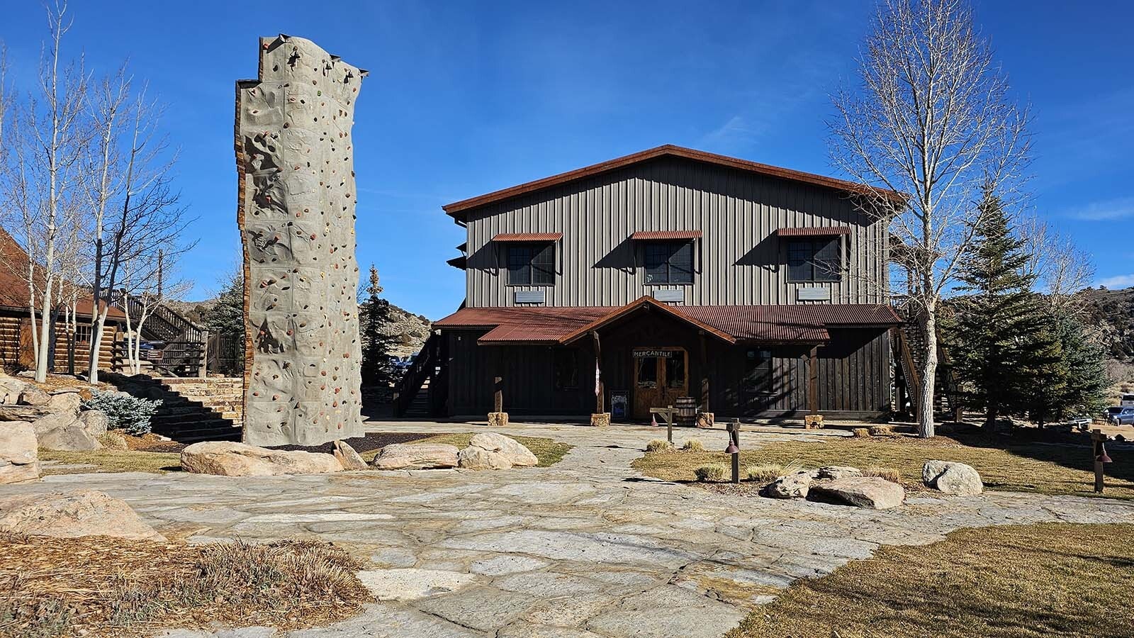 The Mercantile and a rock climbing wall at Brush Creek Ranch.