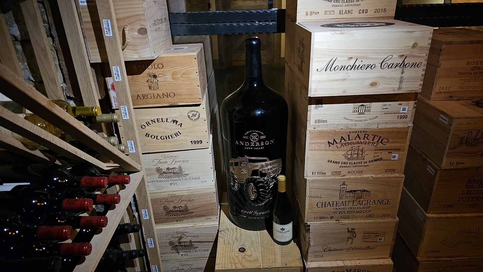 The largest bottle of wine in the Brush Creek Ranch's underground wine cellar is this Jygantor 2016, a primarily Cabernet blend touted for spicy oak and dark fruit flavors. The year 2016 was an especially good one for wines, particularly red ones. The scarcity of this bottle — only six were made — makes this a prize to own. It's one of the ultra rare bottles that's not really for sale at Brush Creek Ranch. The smaller bottle sitting next tot it is a standard, 750 ml size bottle of wine for comparison.