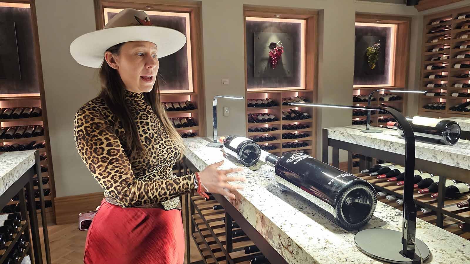 Montana Busche talks about the wines in Brush Creek Ranch's wine cellar.
