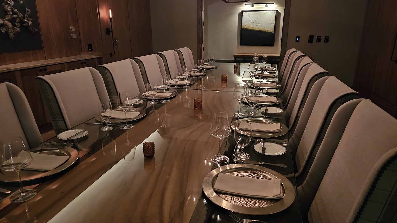 Because of the glass seam in the middle of this table, many people initially think the table in Brush Creek Ranch's Founders Room is in two parts. But the log underneath it is actually one long piece. So long, in fact, the room had to be built around the log.