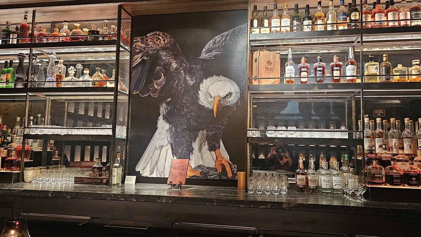 The eagle mural behind the bar sets a patriotic tone for the Spirit Vault at Brush Creek Ranch, where more than 300 spirits await in one of the world's most exclusive tasting experiences.