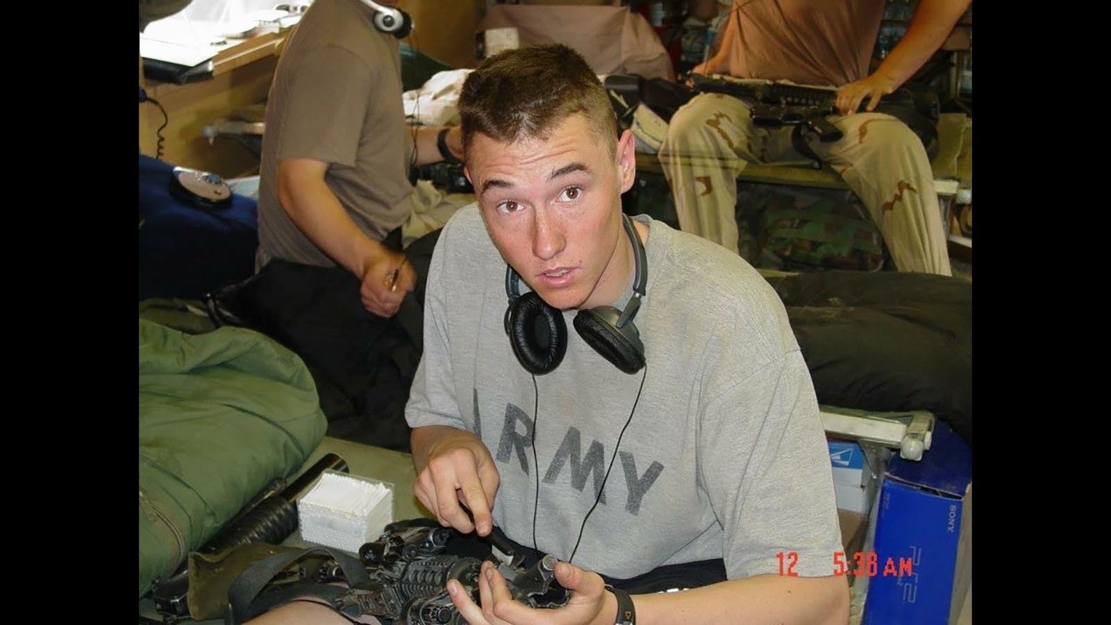 Bryan Price cleans a weapon as a young soldier in the U.S. Army.