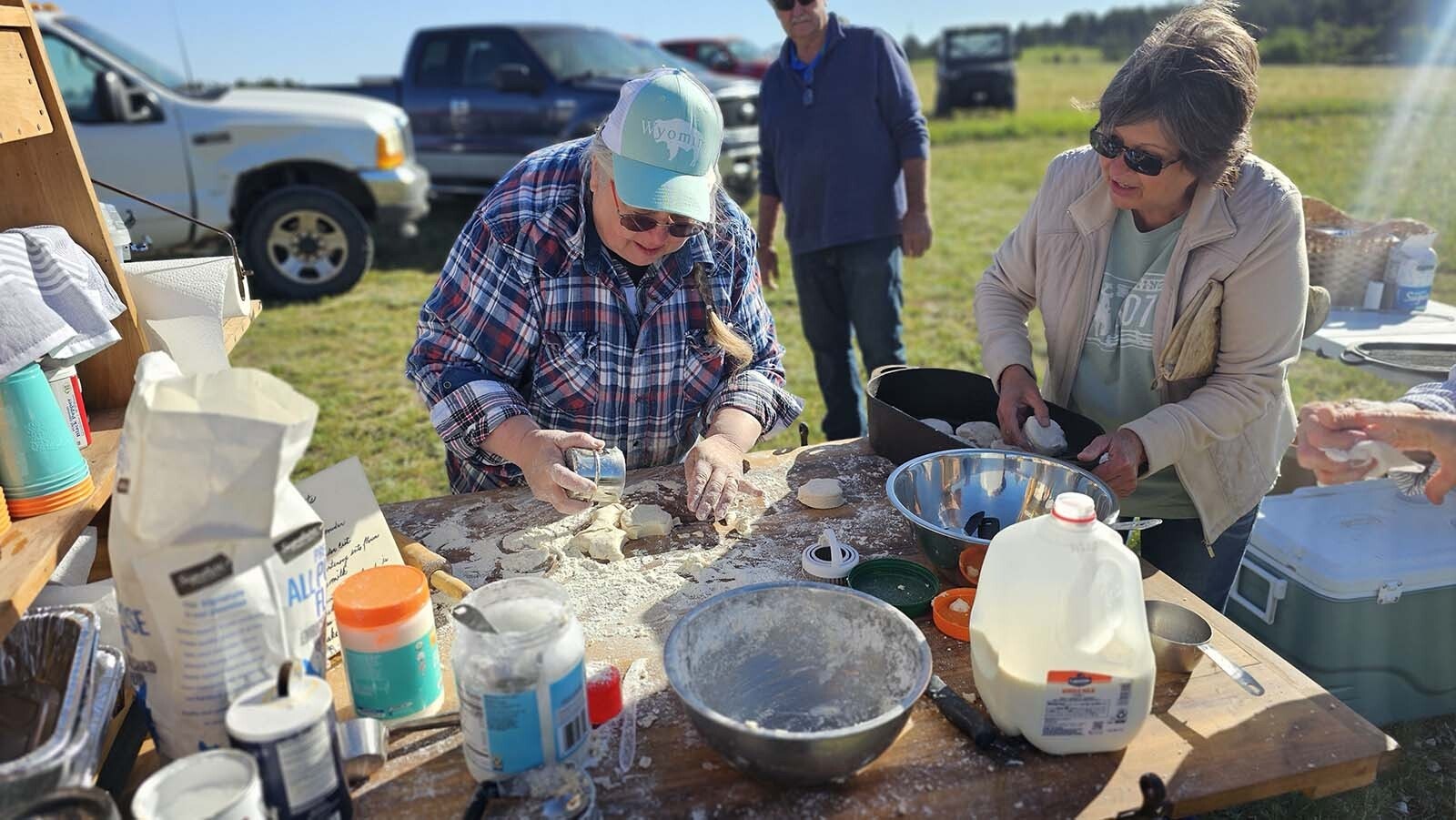 Debbie Arnol, left, and Sherry Armstrong cutting out biscuits at the chuckwagon breakfast before the Buckboard Sunday at Esterbrook Church.