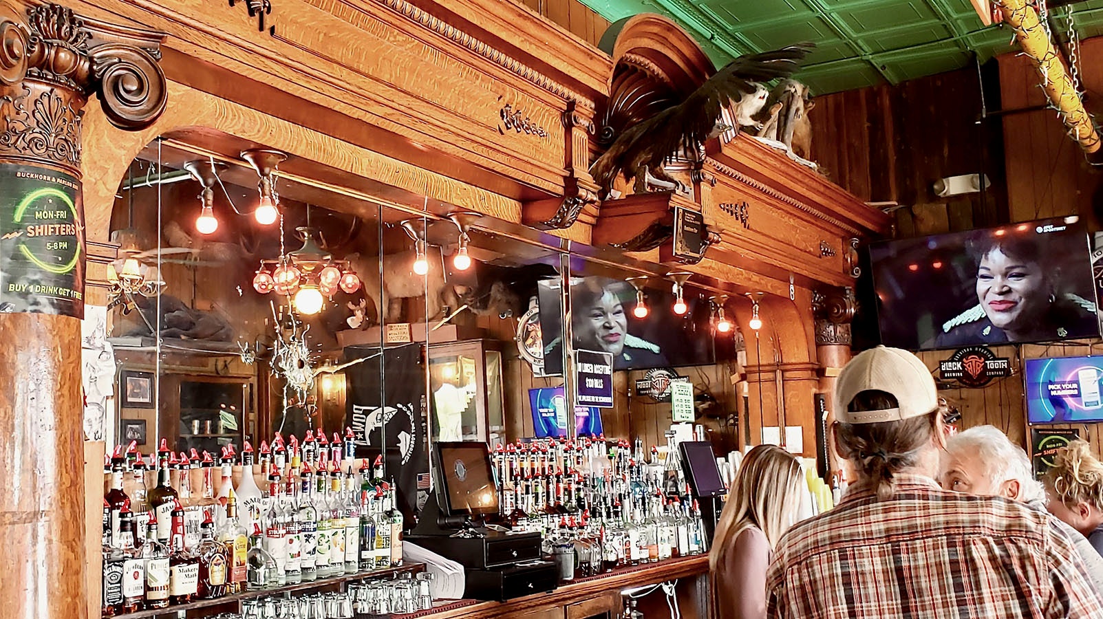 A now-legendary bullet hole to the left is still part of the iconic bar at the Buckhorn, which is listed on the National Register of Historic Places.