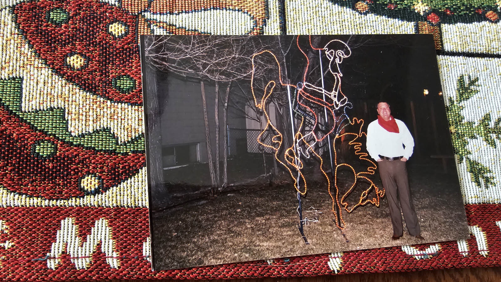 The late Brooks Mitchell in this photo with the bucking horse and Santa rider he commissioned from a specialty welding company in Colorado.