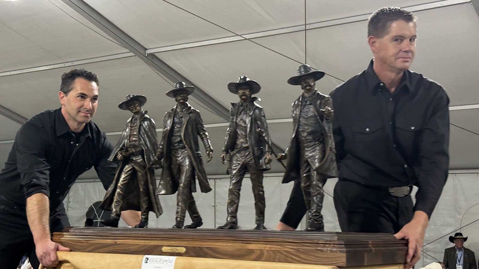 "The Walk of Tombstone" by Vic Payne gets walked down the runway during the 43rd Buffalo Bill Art Show and Sale's live auction. The bronze sculpture sold for $35,000.