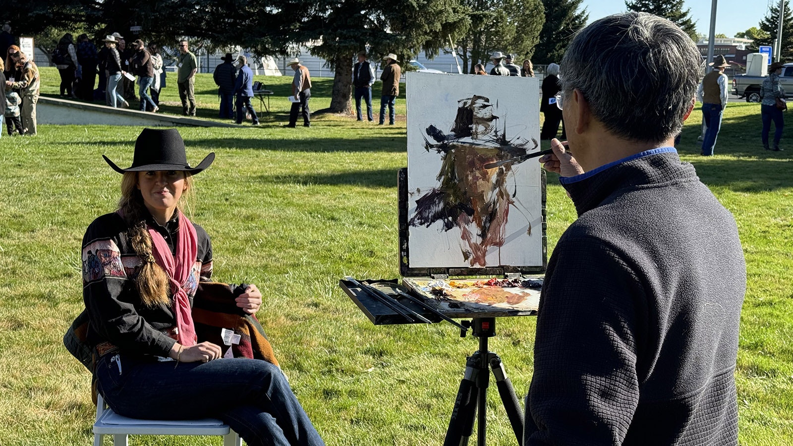 Quang Ho uses a live subject for his Quick Draw painting "Genuine Cowgirl."  The painting sold for $4,250.