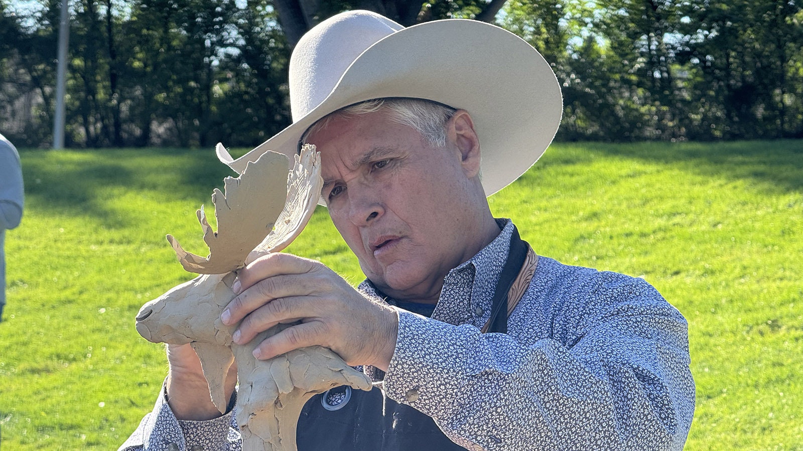 Chris Navarro sculpts "Woody and the Moose" during the 43rd Buffalo Bill Art Show and Sale's Quick Draw. He sold 22 bronze castings of this sculpture, totaling $33,000.