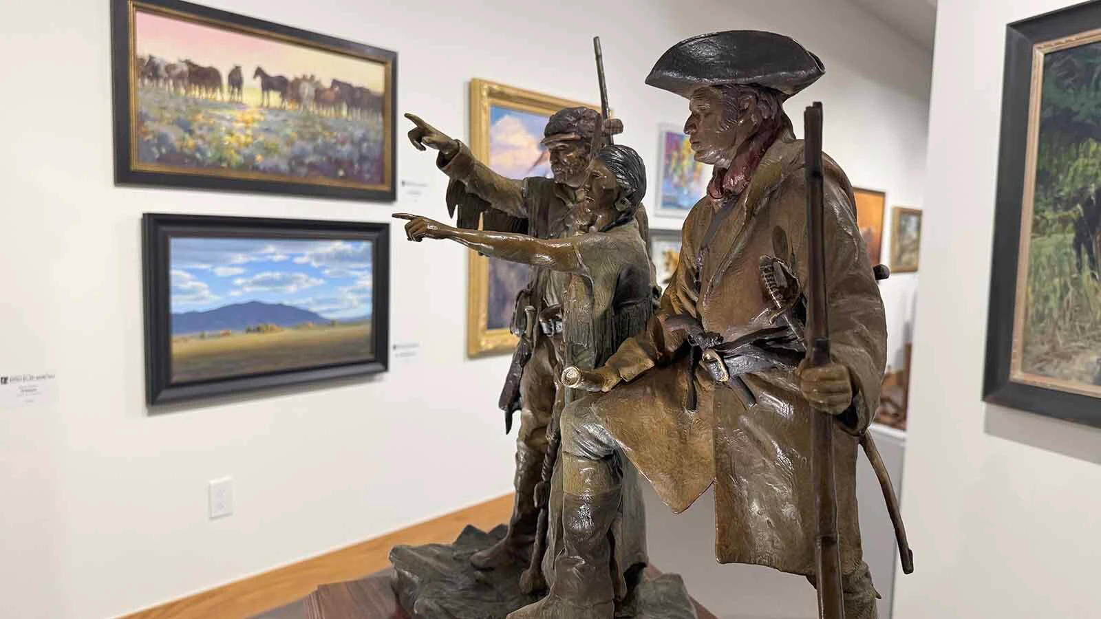 "Dawn of America," a bronze sculpture by Vic Payne, and several other pieces on display at the opening of the 45th Buffalo Bill Art Show and Sale in Cody.