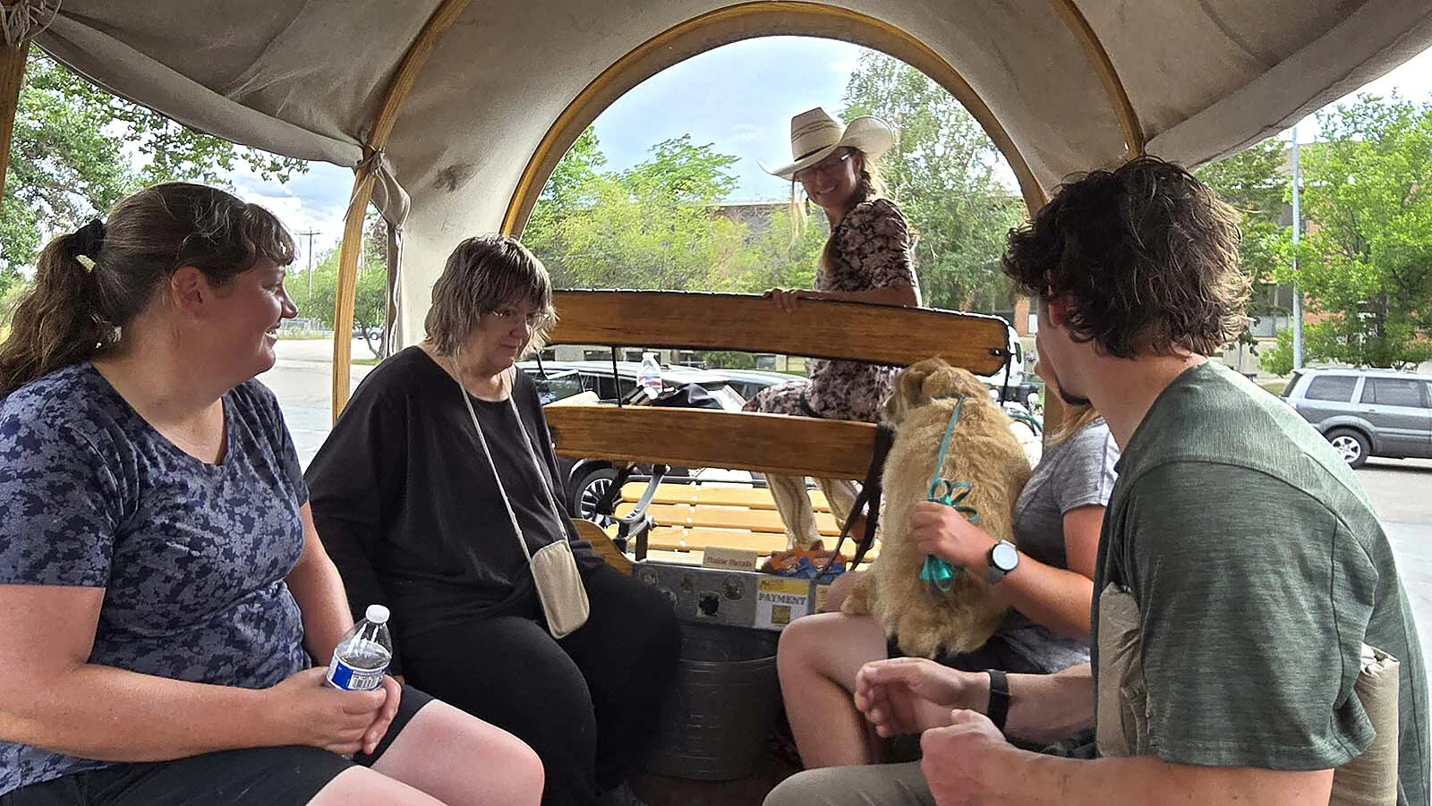 Ashlee Kintzler greets her guests with a smile just before a Moonhitch Wagon tour. Pets are not typically part of the tour, but Kintzler made an exception this time, after talking it over with the other tour participants.
