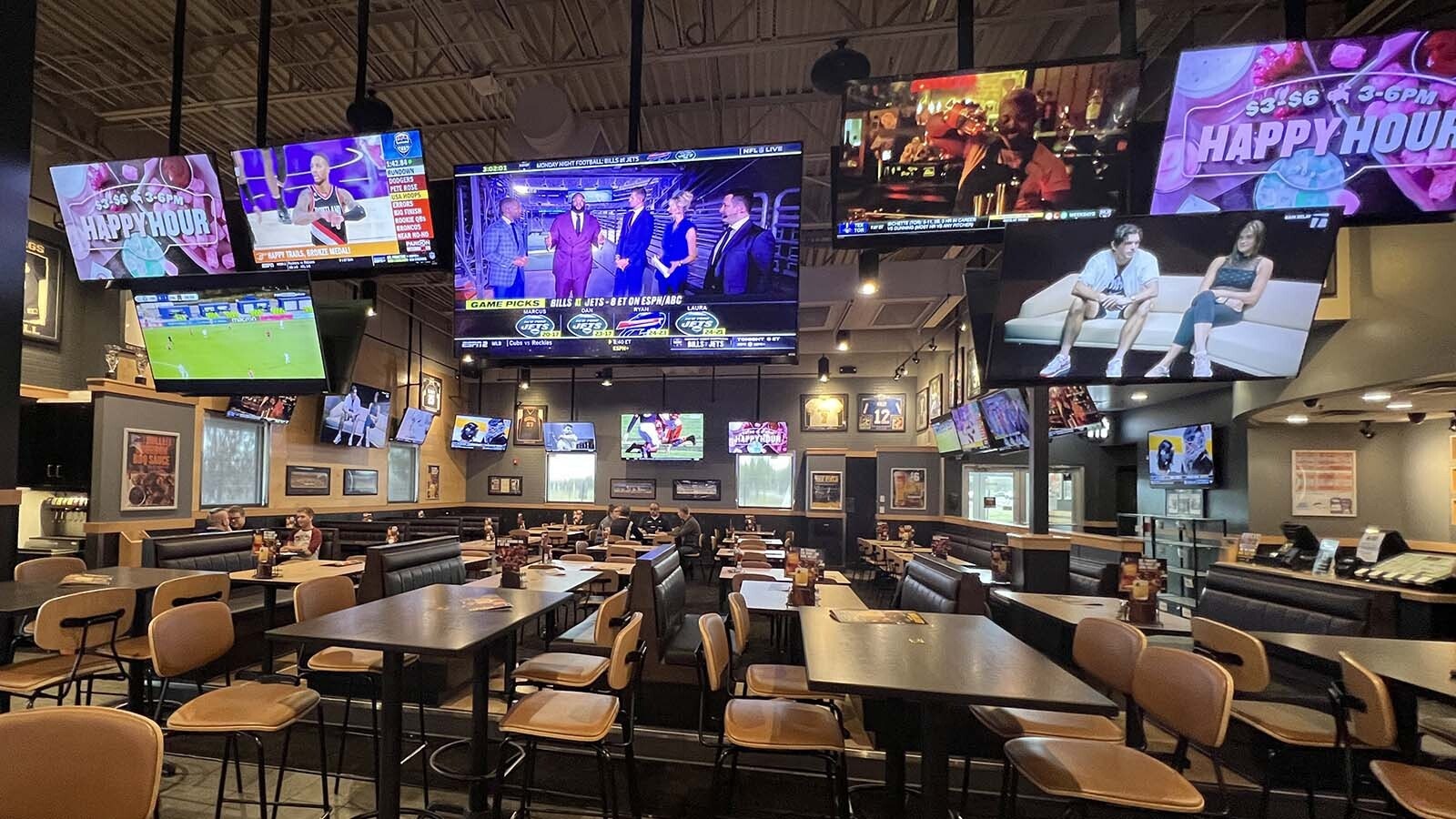 Many of the dozens of big screens in the Cheyenne Buffalo Wild Wings restaurant were tuned to ESPN networks Monday afternoon leading up to Monday Night Football. The channels are available to Wyoming Charter-Spectrum customers again after Disney and Charter reached a deal earlier in the day.
