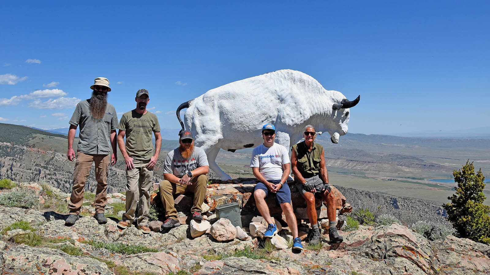 Sam Hanna (from left), Brandon Dallas, Matt Thompson, Brian Beauvais and John Housel reattached the new appendages to the buffalo in June 2025. Ray Hatfield of Nature’s Design Taxidermy donated his time and materials to mold the parts from epoxy resin.