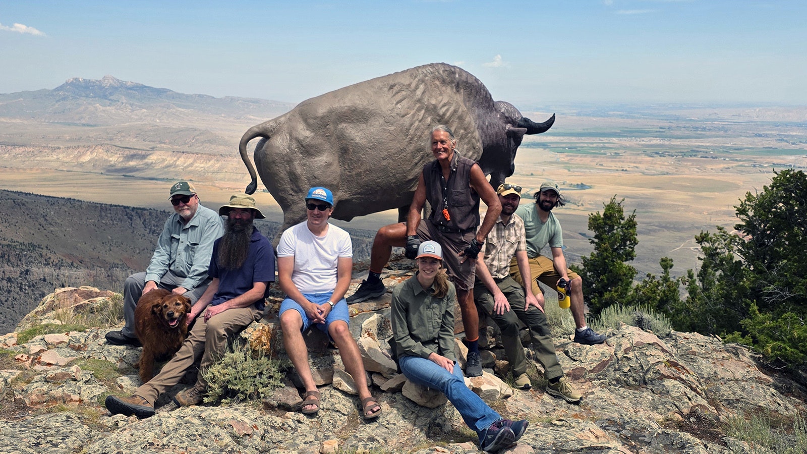 Kent Houston (from left), Sam Hanna, Brian Beauvais, Amy Phillips, John Housel, William Frere and Corey Anco repainted the restored buffalo statue in July 2025.