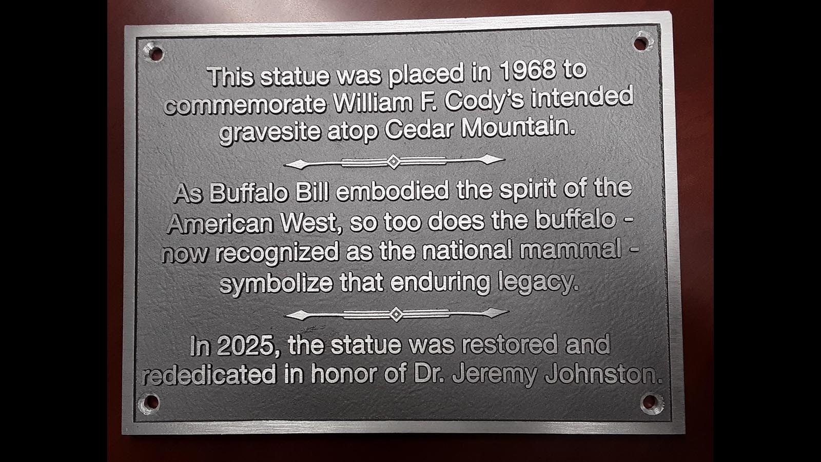 A plaque was placed at the refurbished buffalo statue in the hopes of curbing future vandalism.