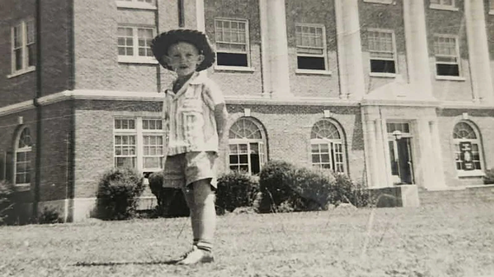 Bob Brotherton grew up in rural 1950s Arkansas. He remembers working alongside grown men when he was in second grade during hot summers to make hay. Above, he's 5 years old standing in front of city hall in Hope, Arkansas.