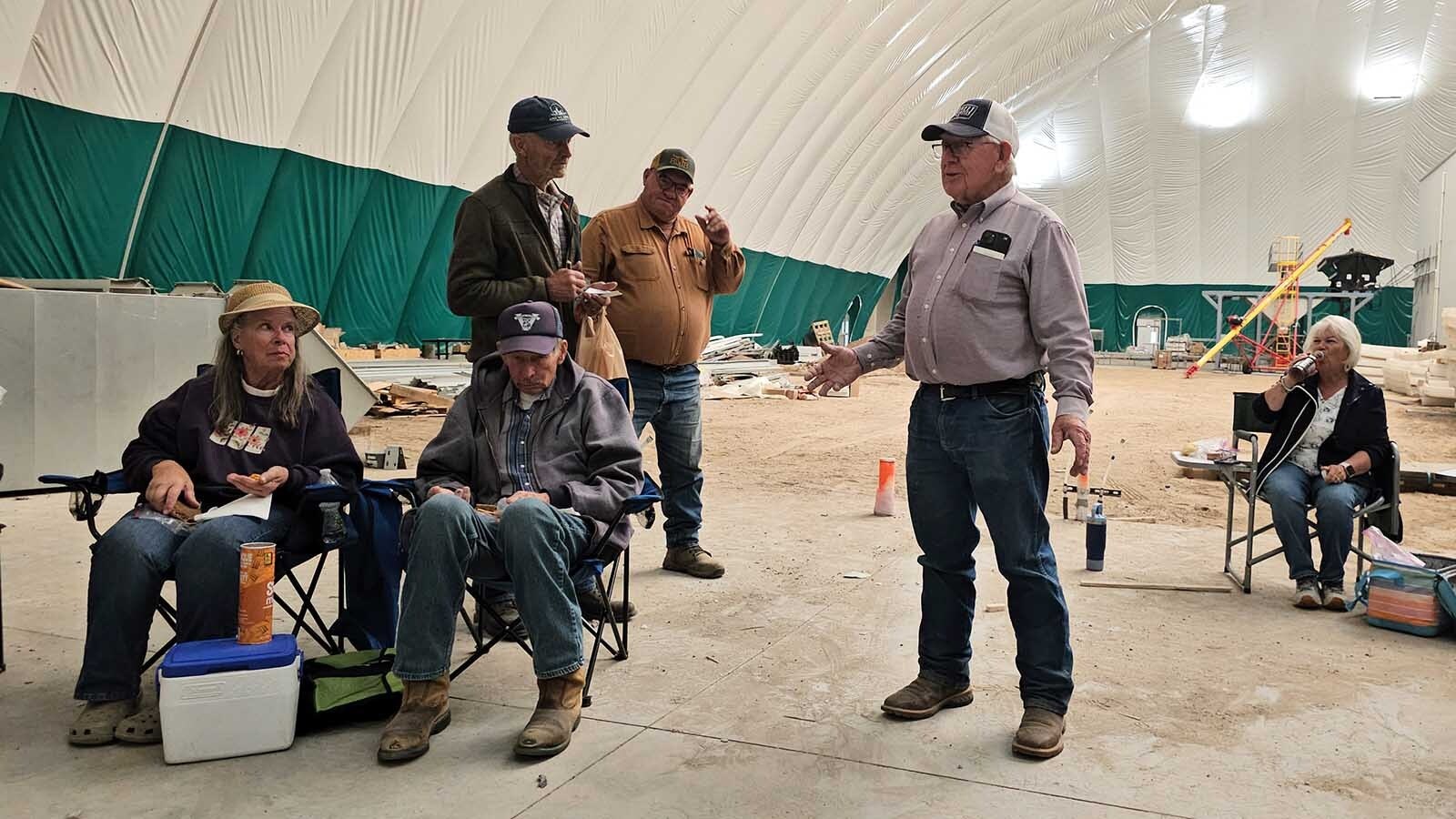 Jerry Burnett talks to members of the Centennial Antique Tractor & Engine Club inside the quonset hut where Burnett Enterprises is pioneering an indoor growing operation for high-quality dairy cow feed using sprouted wheat or corn. Several patents are pending for their process and inventions related to that process.