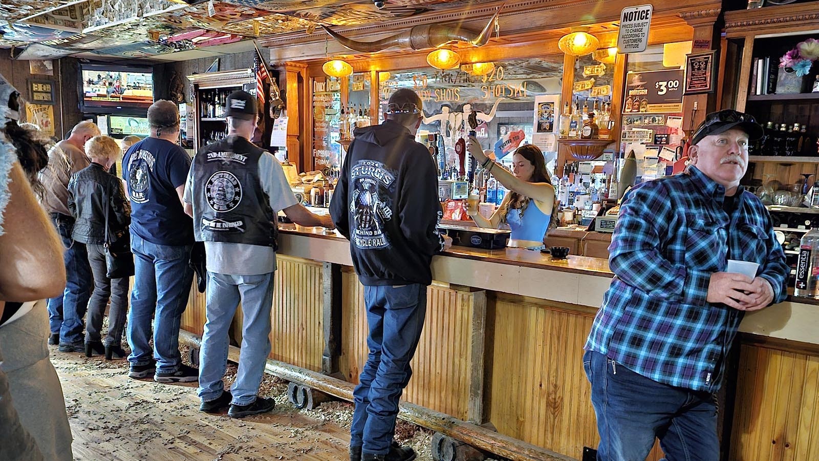 Peanut shells cover the floor at the Dime Horseshoe Bar in Sundance, as patrons await the annual Burnout Wednesday event.