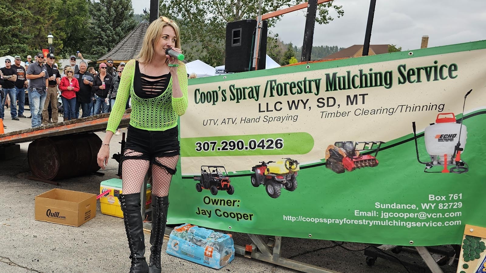 Jess Jones, who owns the Dime Horseshoe Bar with husband Casey, with her burnout boots talks to the crowd ahead of their exhibition burnout ride.