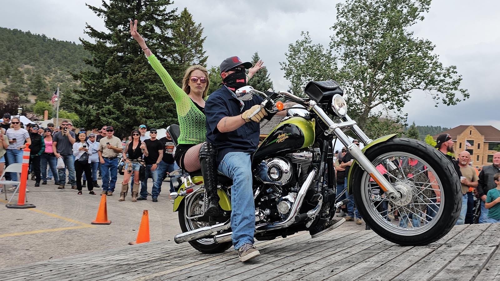 Jess and Jones ride their Harley-Davidson onto the Burnout ramp for an exhibition ride in Sundance.