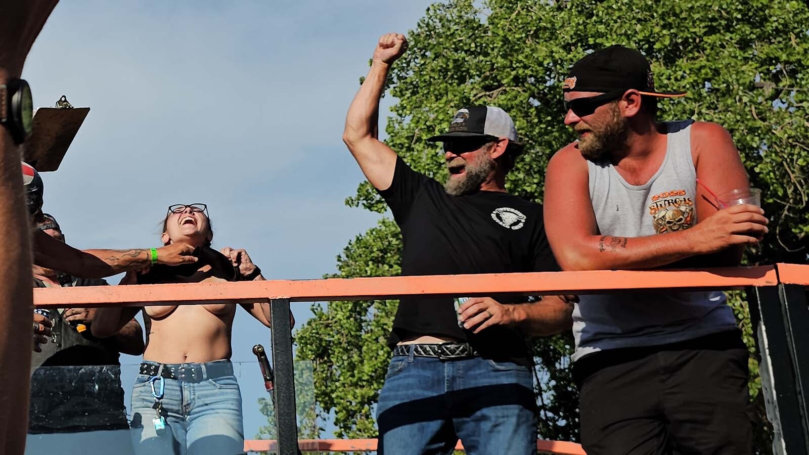 Freddy Boss tries to yank Sierra Goodhouse's top back down during the judging of the burnout. To no avail. The crowd cheered loudly for her anyway.