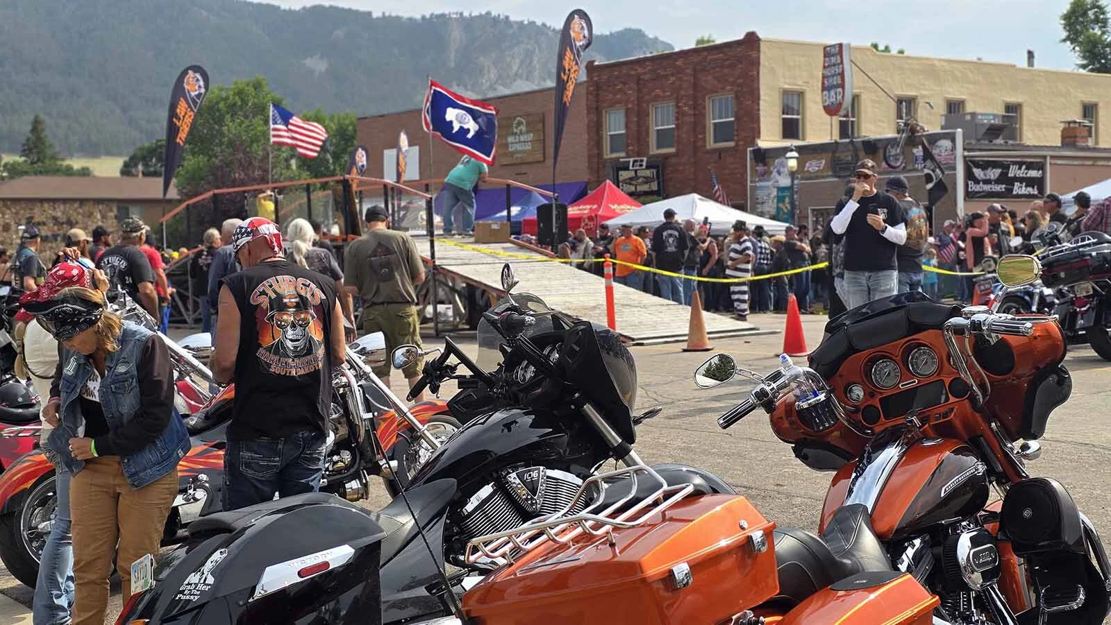 The scene in front of the Dime Horseshoe Bar, where Sturgis Rally goers gathered to watch the annual burnout contest in Sundance.