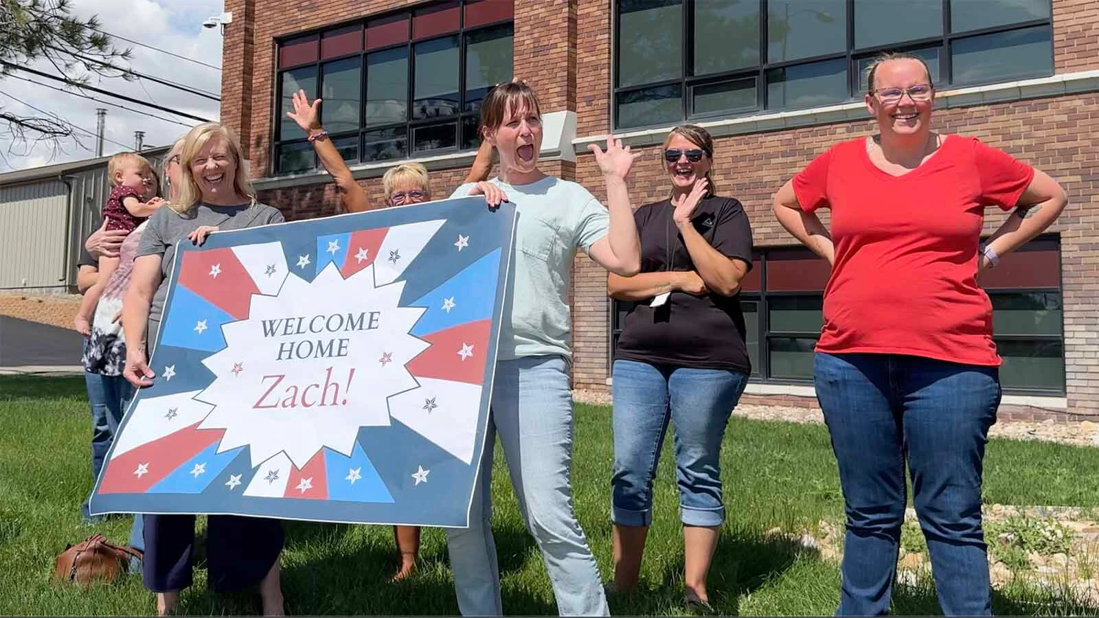 Dozens of people gathered outside the Carbon Building along 3rd Street in Rawlins on Wednesday to welcome Sgt. Zach Burns home.
