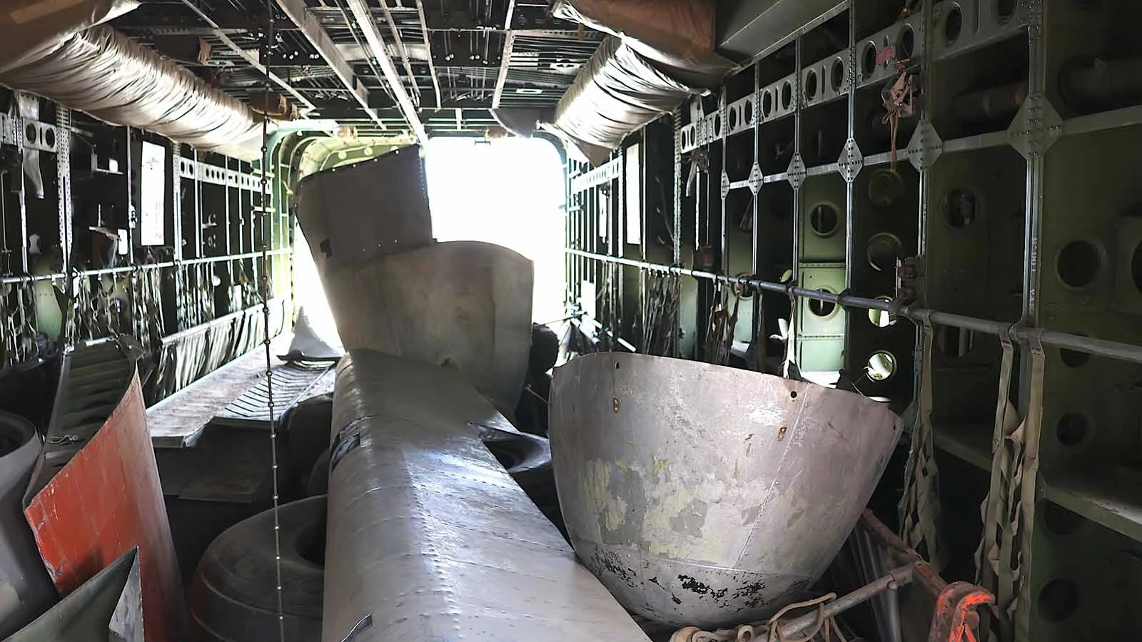 The interior of the cargo bay looking from the front to back. The plane is filled with some parts that belong to the C-119 and other parts that don’t.