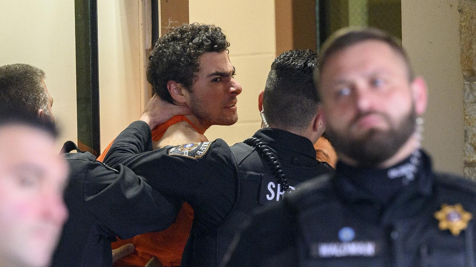 Suspected shooter Luigi Mangione is led into the Blair County Courthouse for an extradition hearing Dec. 10, 2024 in Hollidaysburg, Pennsylvania.