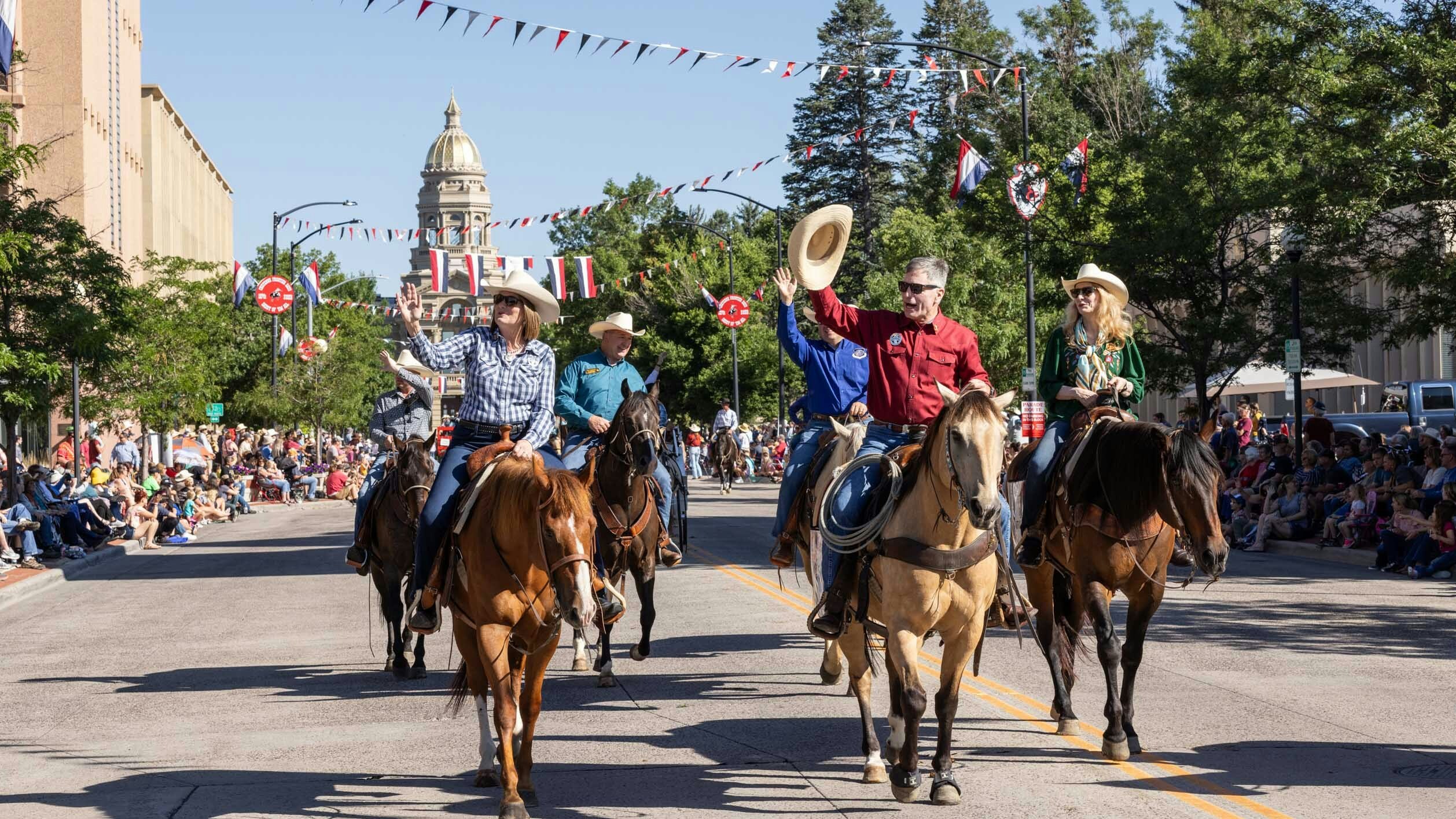 Caption for photo below — Wyoming Governor Mark Gordon and First Lady of Wyoming Jennie Gordon in the parade at Cheyenne Frontier Days on July 23, 2023 in downtown Cheyenne.