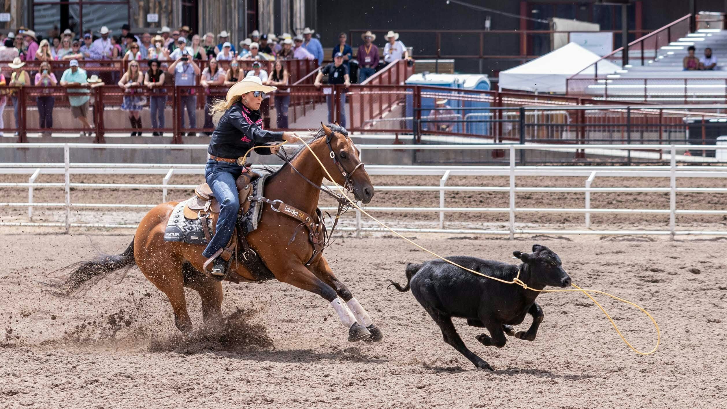 Jackie Crawford from Stephenville, TX ropes her calf in the Breakaway Roping on July 27, 2023.