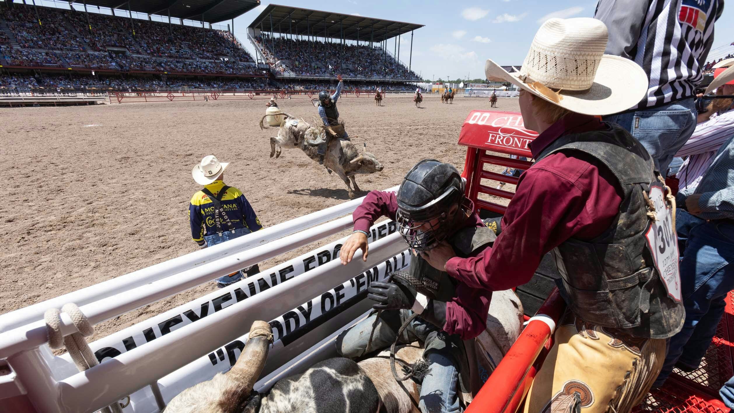 Bull riding action from behind the chutes at the first rodeo performance of Cheyenne Frontier Days on July 22, 2023.