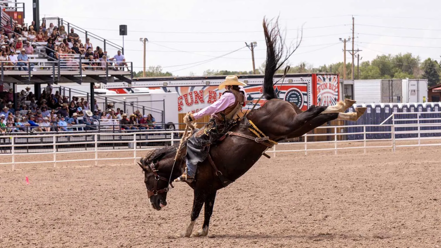 Clay Nyhus from Torrington, WY, in the rookie saddle bronc riding finals at Cheyenne Frontier Days on July 25.
