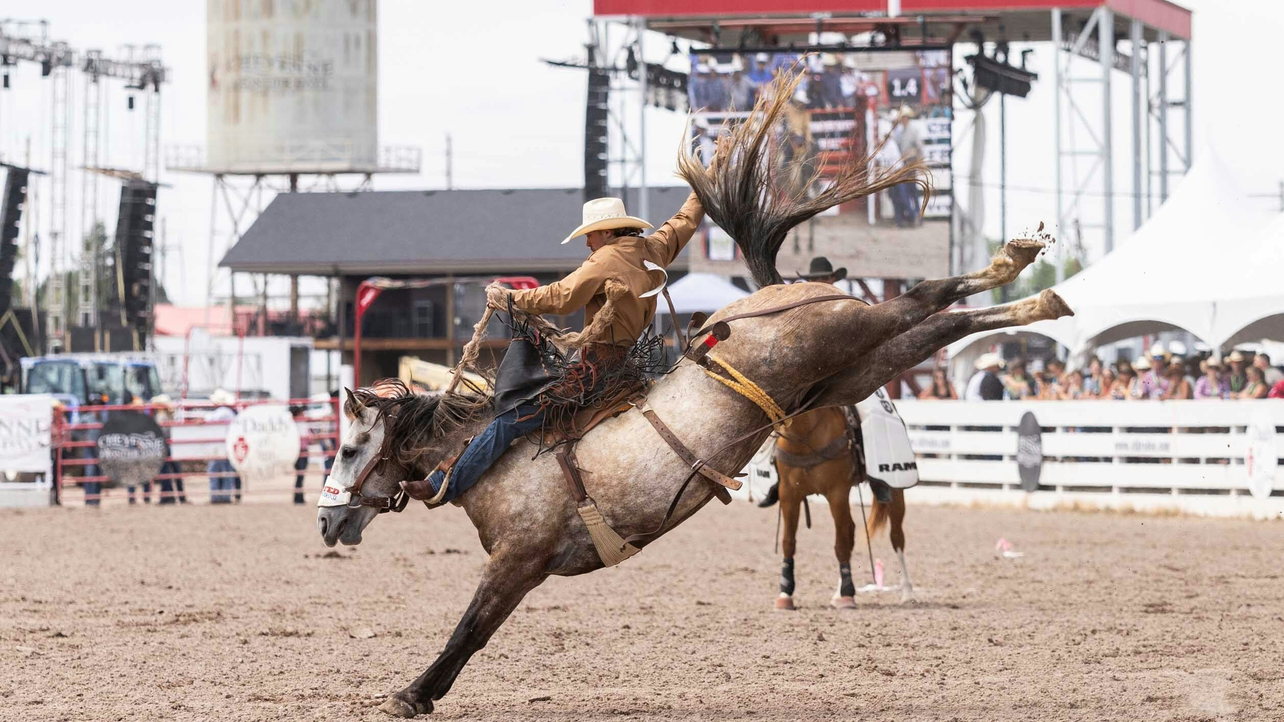 Dylan Hancock from Clarndon, Texas rides his saddlebronc horse for 79 points at Cheyenne Frontier Days on July 23, 2023.