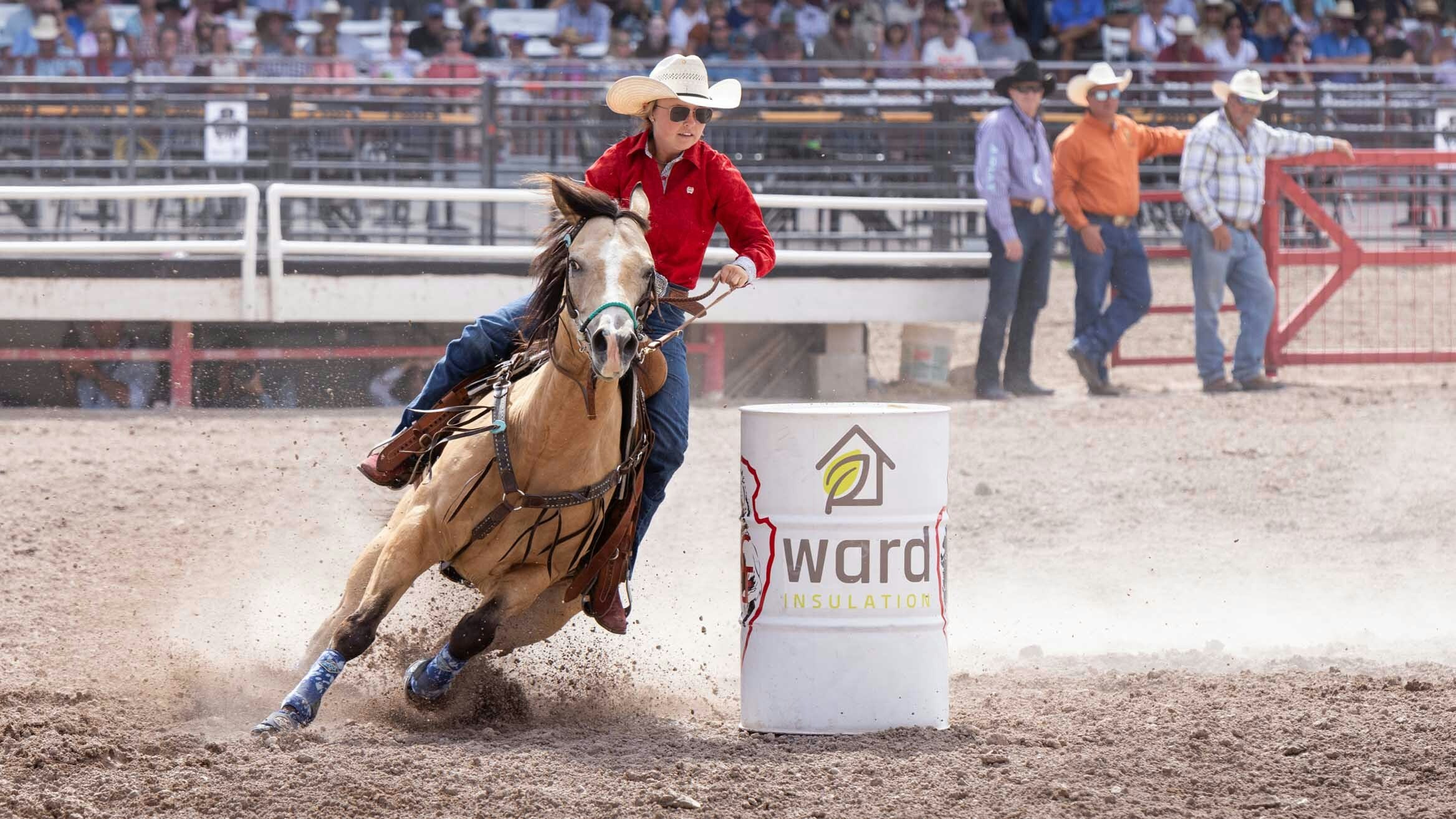 Kelby Eastman from Pine Bluffs, Wyoming goes around the third barrel in the barrel racing at Cheyenne Frontier Days on July 25, 2023.