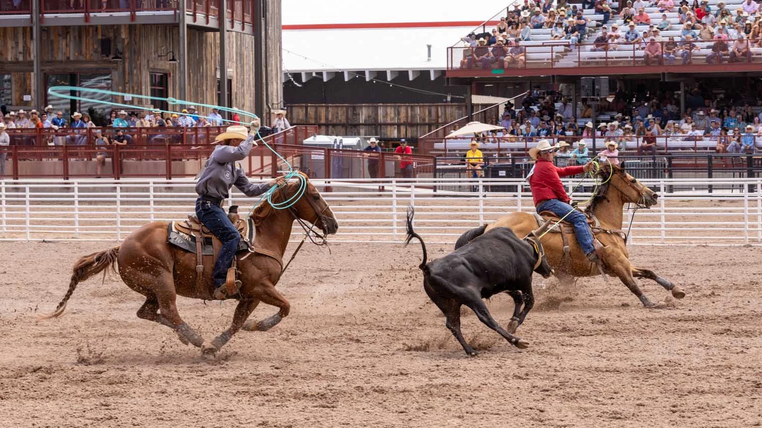 Clayton Van Aken from Yoder, WY, and Jaydon Warner from Tropic, UT, in the team roping at Cheyenne Frontier Days on July 25. 