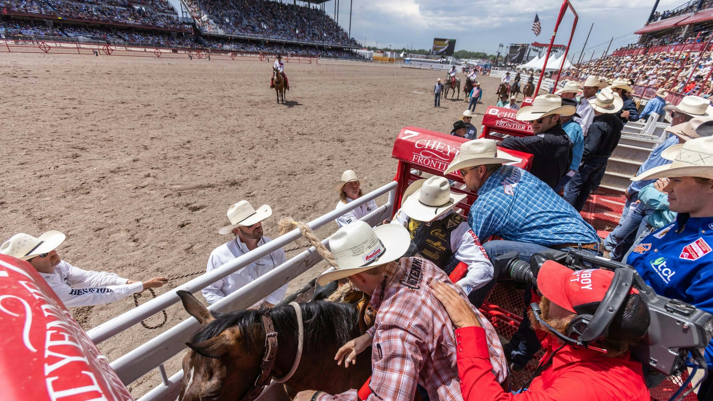 Saddle Bronc action from behind the chutes at Cheyenne Frontier Days on July 29, 2023.