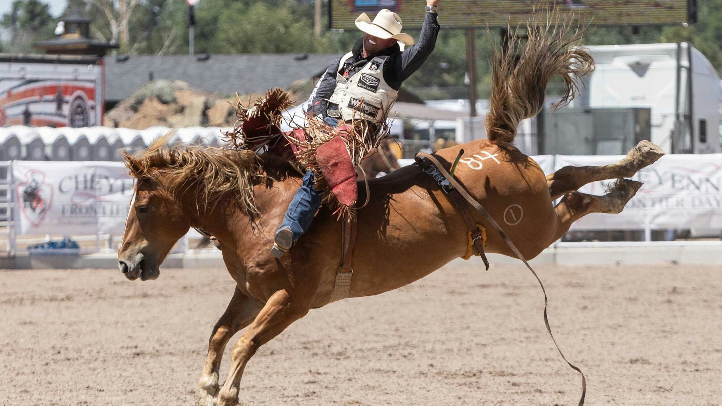 Matthew Smith from Saraland, Alabama rides his bareback horse for a score of 82.50 at Cheyenne Frontier Days on July 24, 2023.