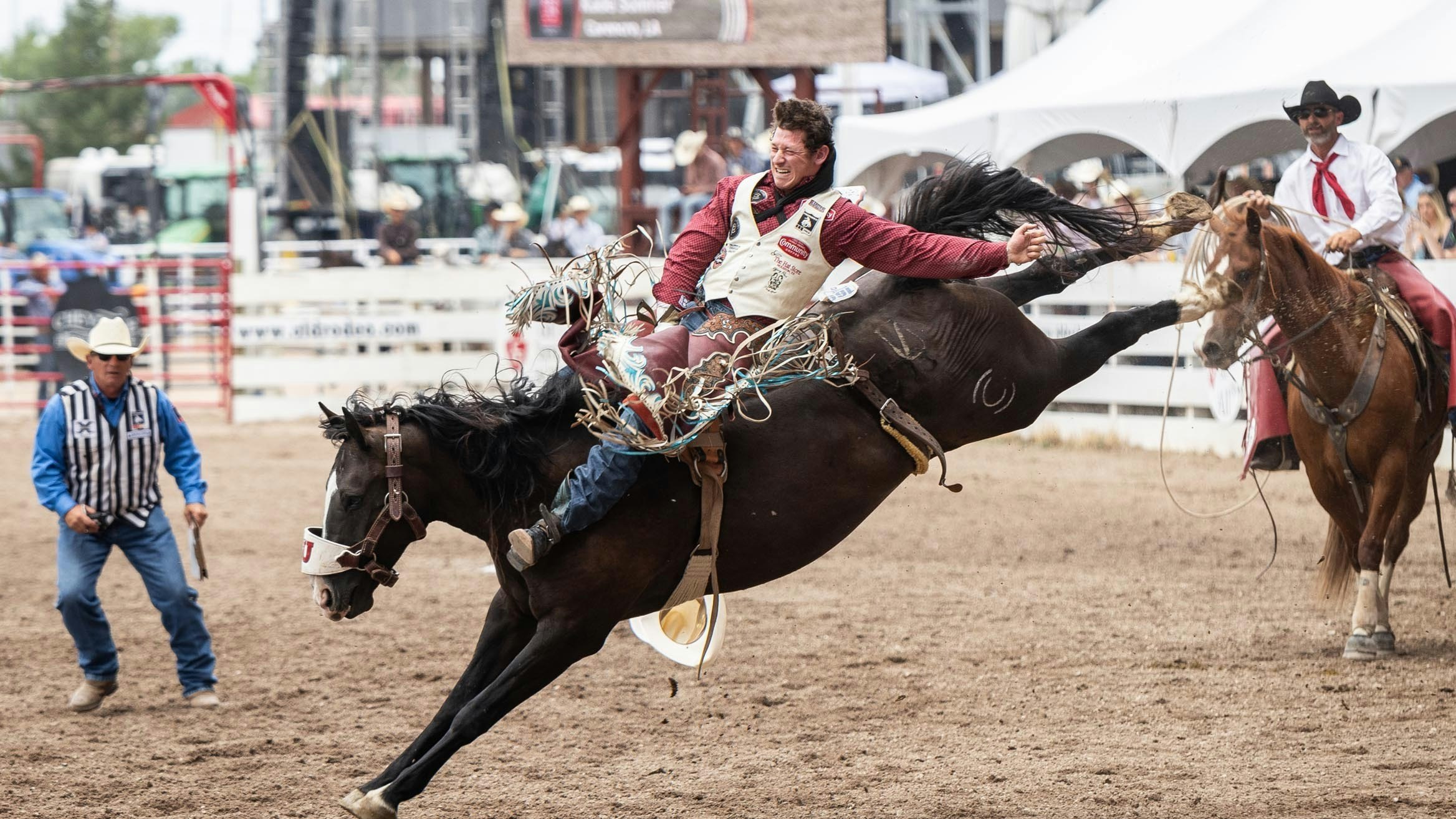 Kade Sonnier from Carencro, LA rides his bronc in the bareback riding for a score of 84 points at Cheyenne Frontier Days on July 26, 2023.